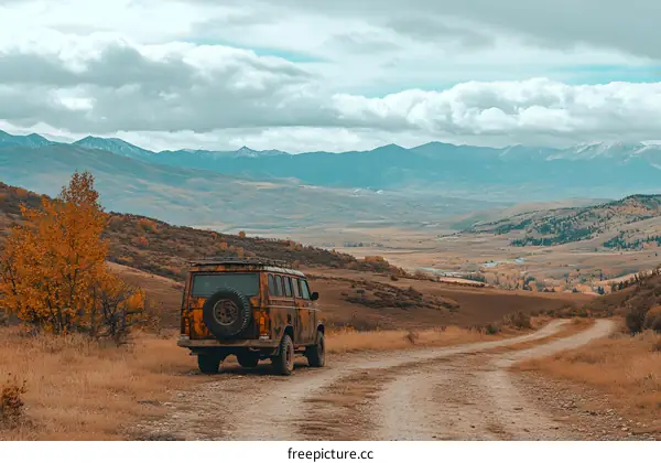 Rustic Van Parked on a Dirt Road with Mountain Views