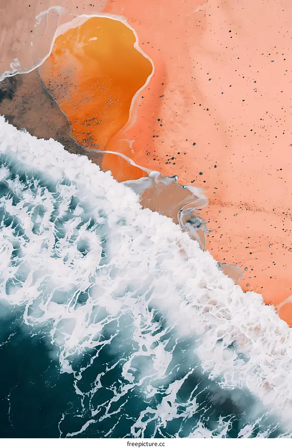 Aerial View of Ocean Waves Crashing on Sandy Beach