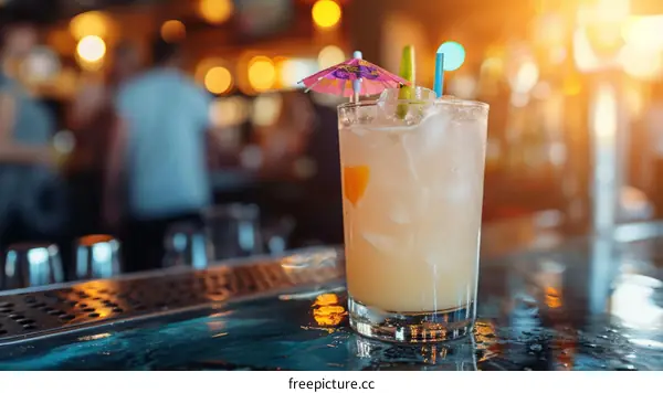 bartender makes a cocktail drink at a bar