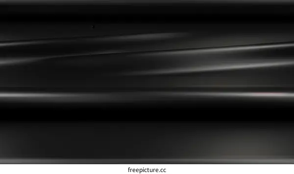 Black wavy silk fabric with a shiny surface