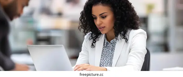 Businesswoman Working on Laptop in Office
