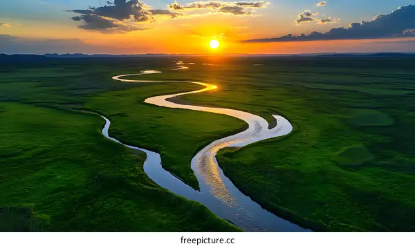Sunrise over a Winding River in a Lush Meadow