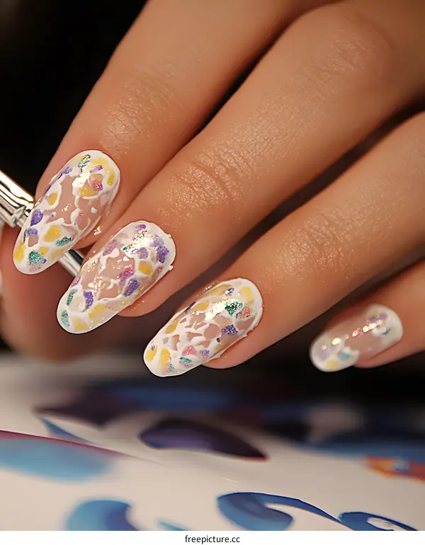Close Up of Woman Hand with Multicolored Glitter Nail Polish