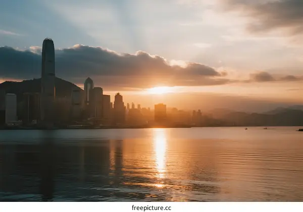 Sunset over the city skyline with reflections on the water