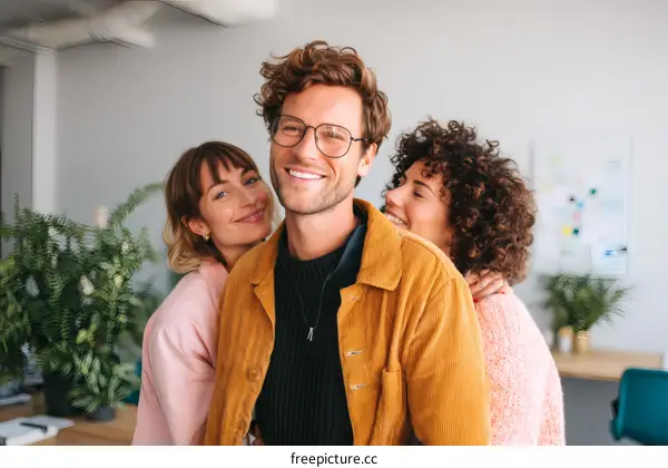 Happy Colleagues Embrace in Modern Office