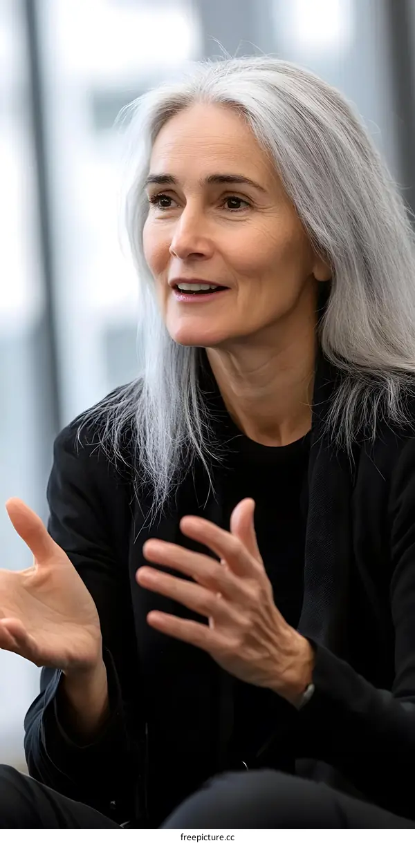 Portrait of an Elderly Woman With Gray Hair Wearing a Black Blazer