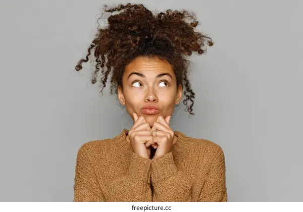 Thoughtful Woman Portrait in a Knitted Sweater