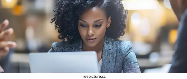 Focused Businesswoman Working on Laptop