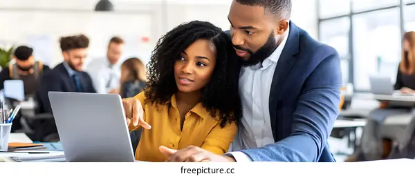 African American and African American Business Partners Working on Laptop