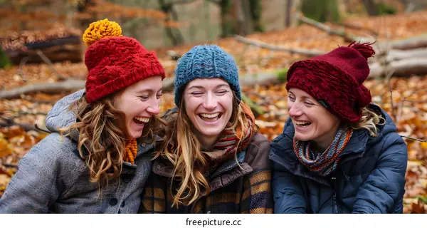 Three Women Laughing in the Forest in Autumn