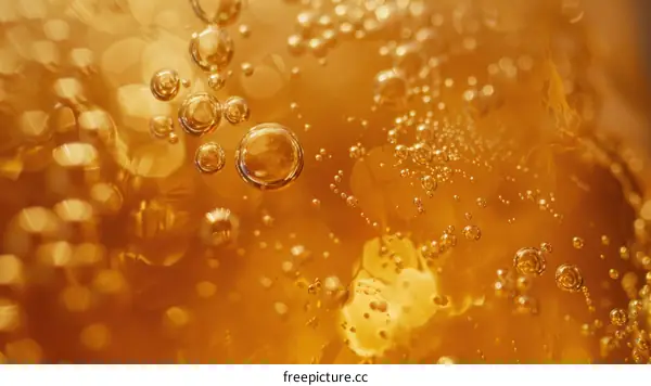 Close-up of Bubbles in Amber Liquid