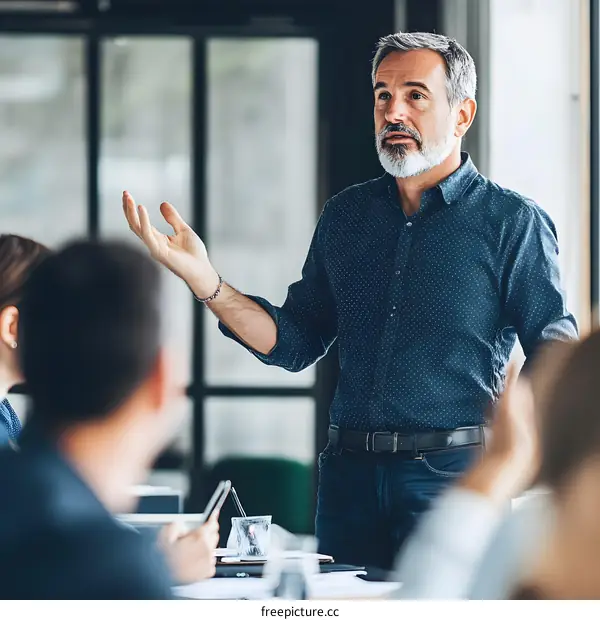 Businessman Giving Presentation In Modern Office