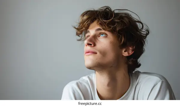 Portrait of a young man looking up