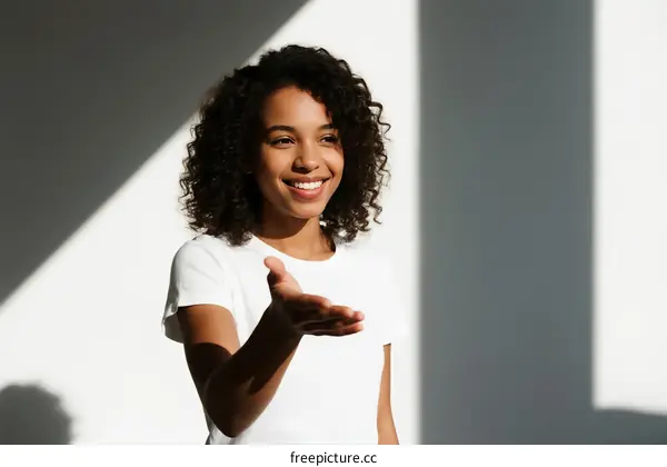 Young Woman with Curly Hair Extending Hand in Greeting