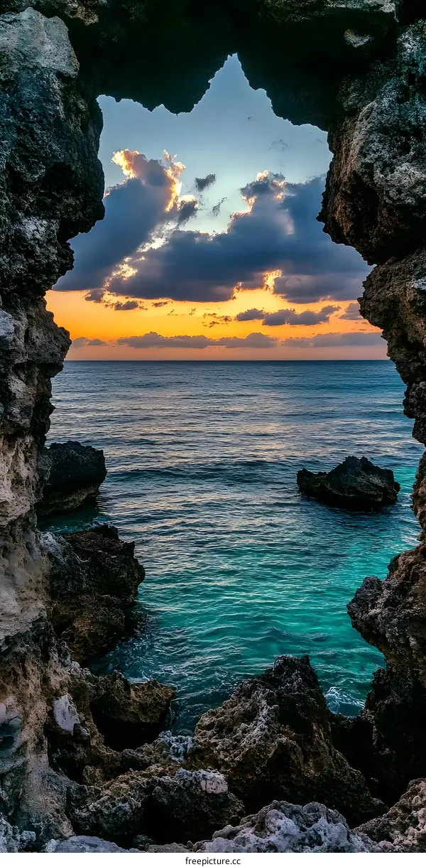 Ocean View Through Rock Formation at Sunset