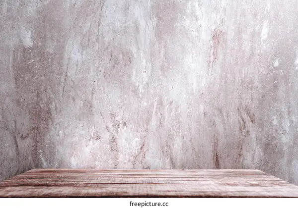 Rustic Wooden Tabletop Against Grunge Concrete Wall Background