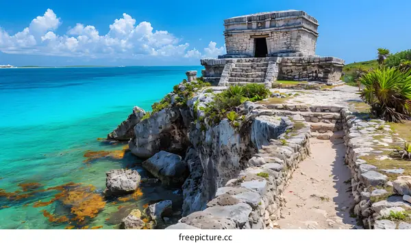 Ancient Mayan temple perched on a cliff overlooking the Caribbean Sea