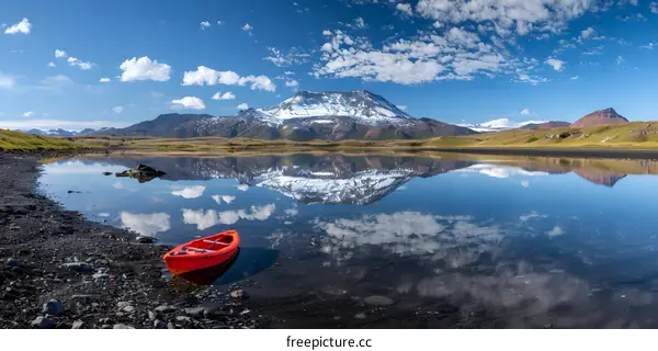Red Kayak in the Mountain Lake