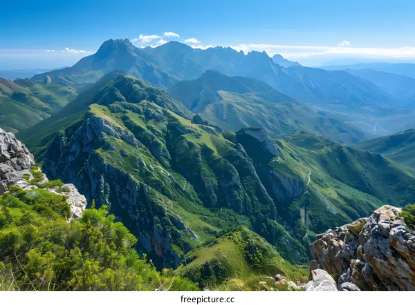 Rocky Mountains landscape with green hills and blue sky