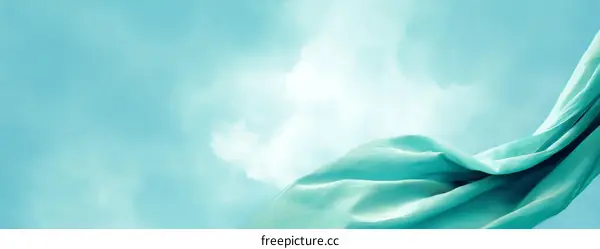 Light Teal Fabric Drape Against a Light Sky