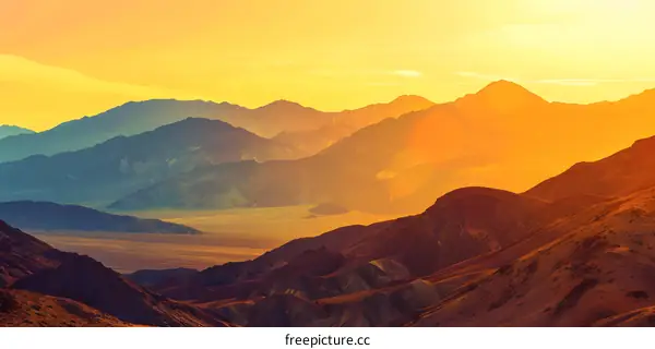 Sunset Over Mountain Range In Desert