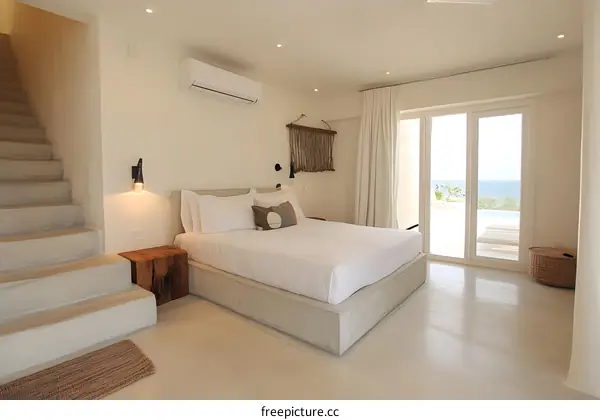 Minimalist Bedroom with Ocean View and Concrete Bed