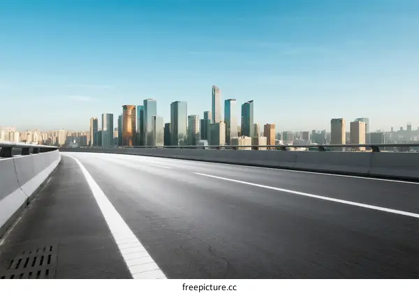 Modern city road with tall buildings in the background