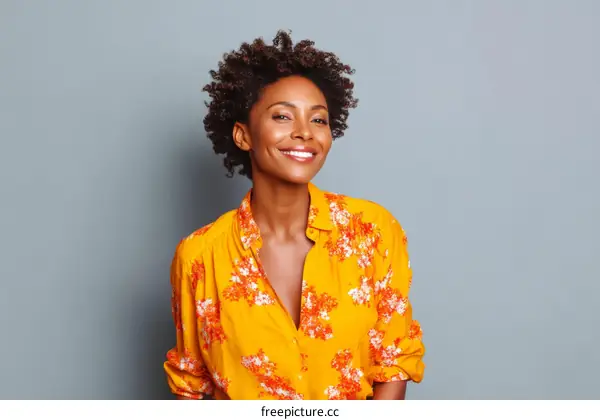 Smiling Black Woman in Yellow Floral Shirt