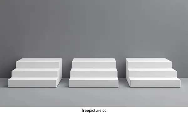 Three White Steps Display Stand Against Gray Background