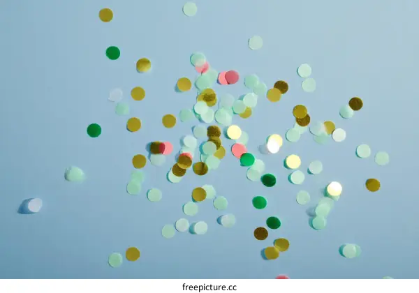 Colorful Confetti Scattered on Light Blue Background