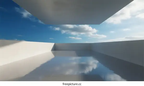 White Minimalist Architecture with Reflective Water Pool Under Cloudy Sky