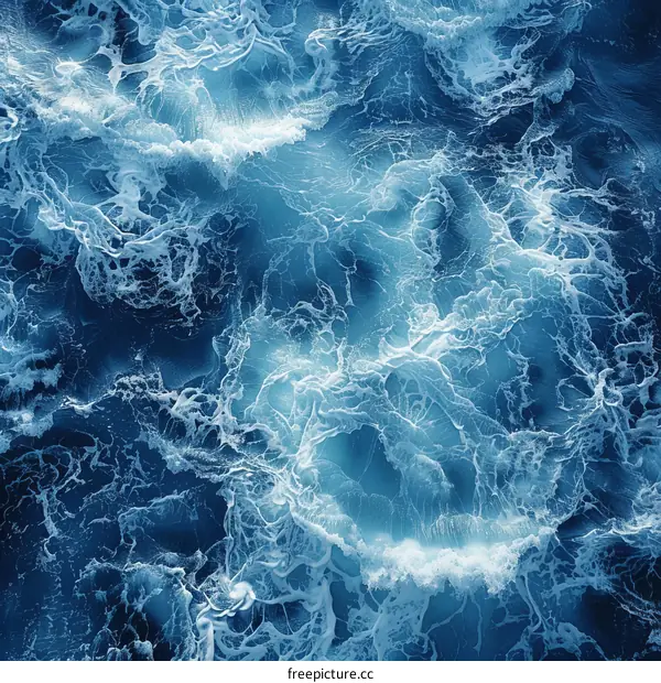 Deep Blue Ocean Surface with White Foamy Waves
