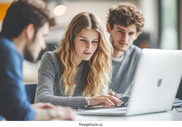 Students Working Together on a Laptop