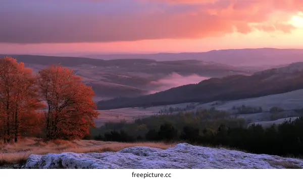 Autumnal Sunrise Over a Valley Landscape