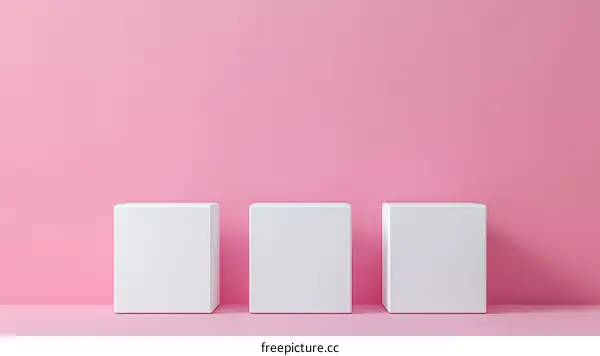 Three White Cubes on a Pink Background