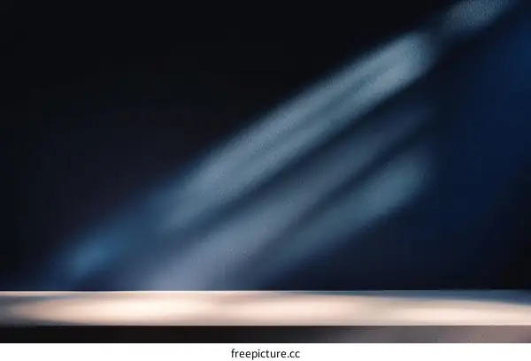 Empty Dark Room with Sunlight and a Tabletop
