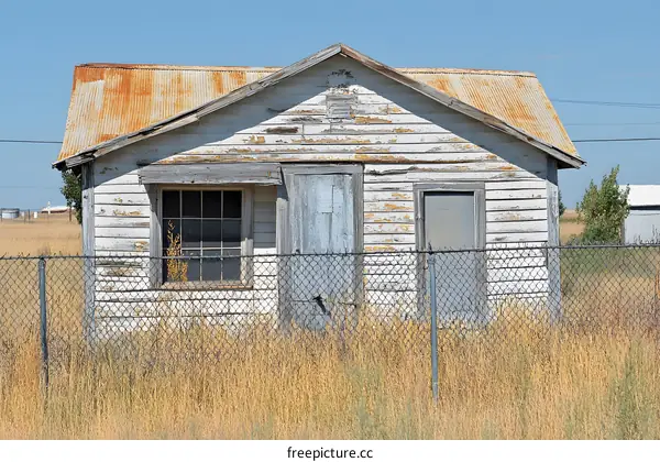 Old Abandoned House With Rusty Roof