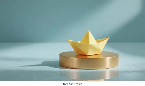 Golden Origami Boat on a Modern Display
