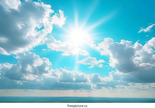 Blue sky with white clouds and bright shining sun