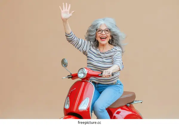 Senior Woman Riding a Red Scooter