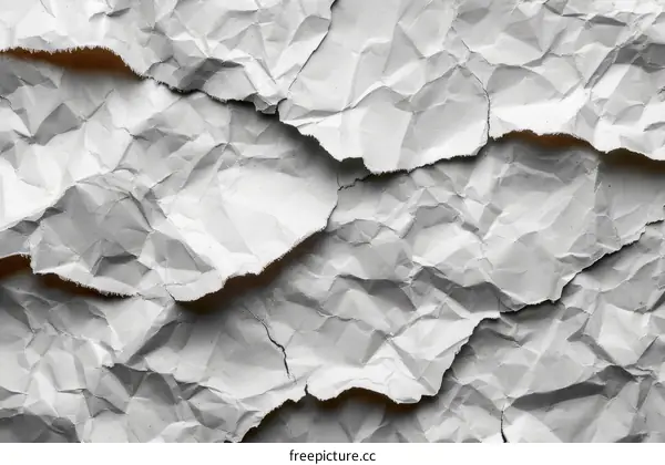 Crumpled paper texture background in white