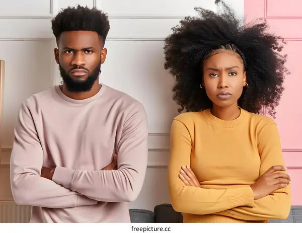 Angry African American Couple Arms Crossed Standing Near Wall