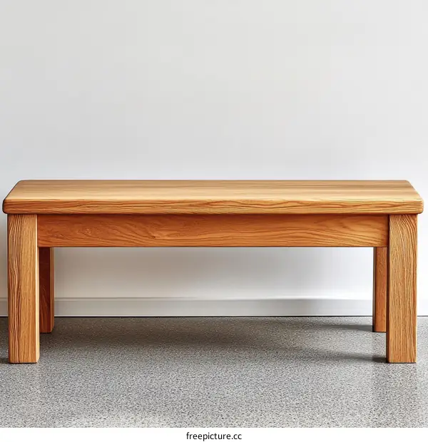 Simple Wooden Bench Against White Wall