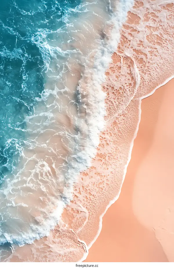 Aerial View of Ocean Waves Crashing on Sandy Beach