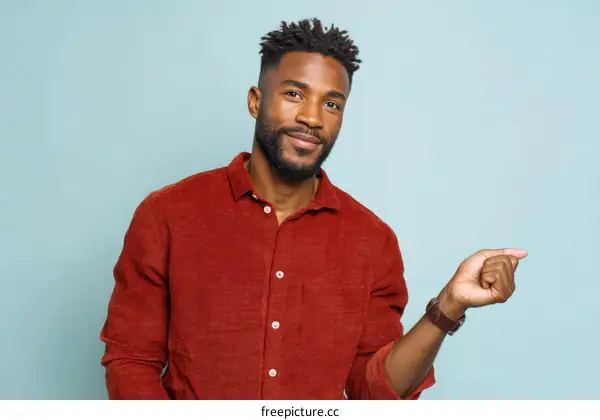 Portrait of a Confident Black Man in a Rust-Colored Shirt