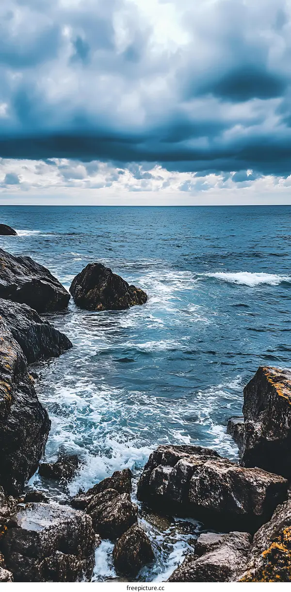 Ocean View with Rocks and Cloudy Sky