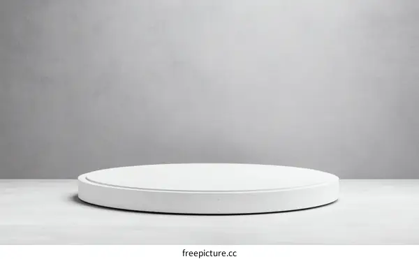 White Round Display Podium on Grey Wall Background