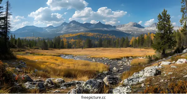 Mountain valley landscape with river and trees in autumn