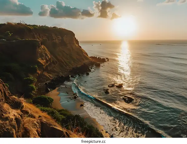 Aerial View of a Cliff Overlooking the Ocean at Sunset