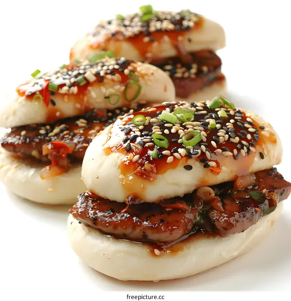 Steamed buns with pork belly and black sesame seeds